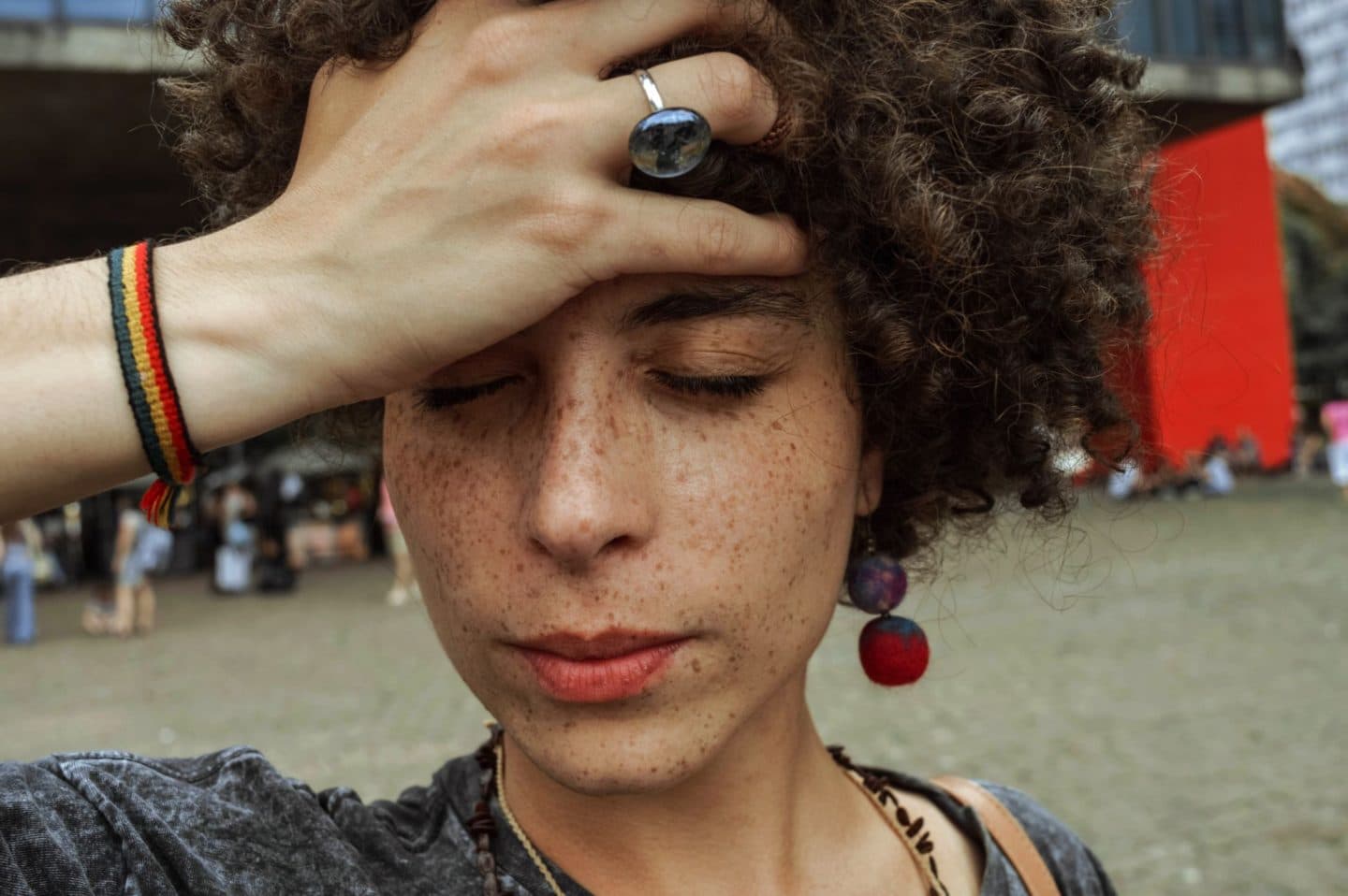 woman holding her head as though she is stressed