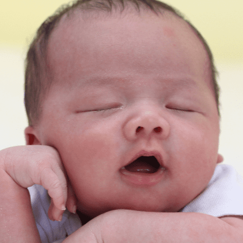 cute baby asleep with mouth open