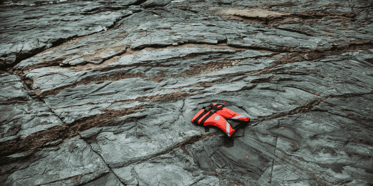 life jacket on the rocks by the sea