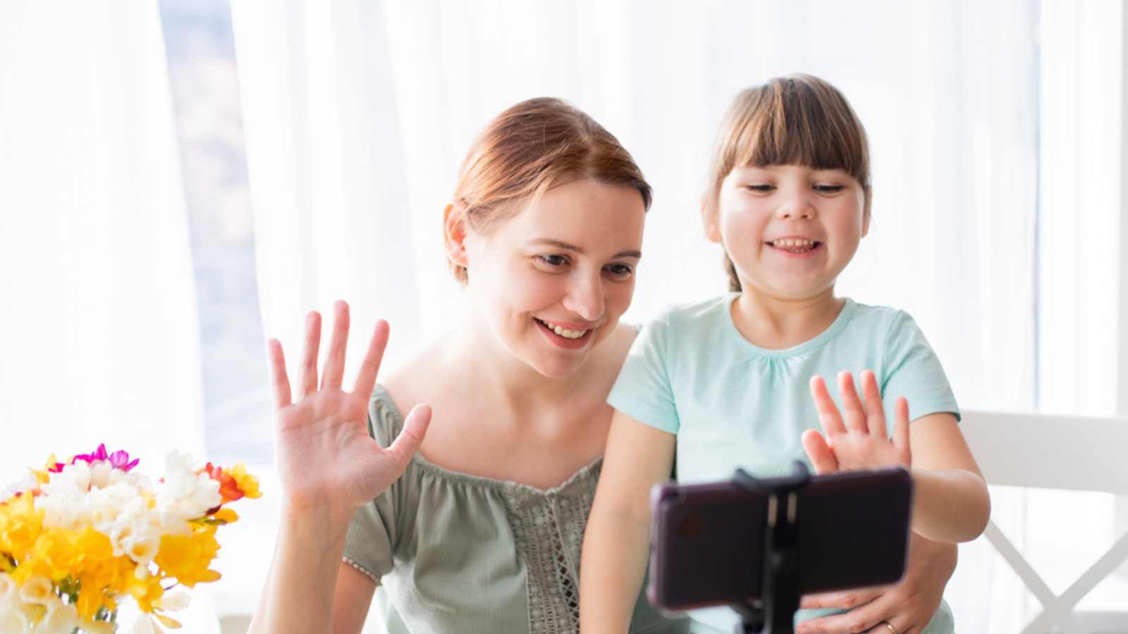 Woman taking video of child